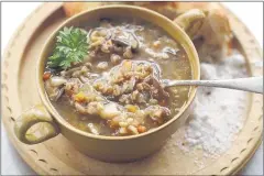  ?? MATTHEW MEAD/ASSOCIATED PRESS ?? Chef Tal Ronnen isn’t a fan of vegetables disguised as burgers. His recipes, such as this Mushroom Farrow Soup, get savory flavor from ingredient­s like shiitake mushrooms.