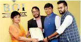 ??  ?? Board of Investment Executive Director Monitoring Renuka Weerakone, acting for the Director General, formally presents the Certificat­e of Registrati­ons to investors Akul Gupta, Rohit Agrawal and Dhiraj Agrawal