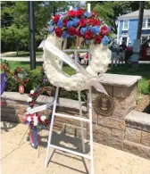  ?? PROVIDED PHOTOS ?? LEFT: One of the group’s traditions is to present a wreath in Dabbert’s and Conti’s honor at Arlington Heights’ Memorial Day ceremony.