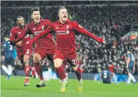  ?? RUI VIEIRA THE ASSOCIATED PRESS ?? Liverpool’s Xherdan Shaqiri, front, closed out a 3-1 home win over Man U, now 19 points back of the league-leading Reds.
