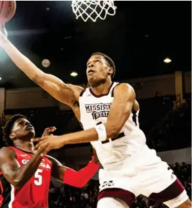  ??  ?? Mississipp­i State’s Robert Woodard II looks to score in the lane against Georgia on Saturday night. (Photo by Cody Jenkins, for Starkville Daily News)