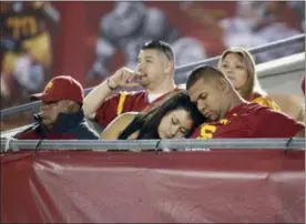  ?? DANNY MOLOSHOK — ASSOCIATED PRESS ?? In this Sept. 5, 2015, file photo, Southern California fans sleep at the end of a game against Arkansas State in Los Angeles.