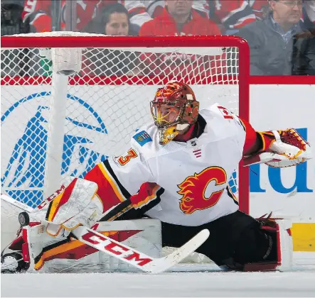  ?? JIM MCISAAC/GETTY IMAGES ?? With an injury to starter Mike Smith, the Flames goaltendin­g duties will be handled by David Rittich beginning tonight in Minnesota. Unlike a year ago when he struggled in relief of Smith, Rittich has been red-hot this season sporting a 9-3-1 record and 2.31 goals-against average.