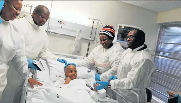  ?? Picture: SUPPLIED ?? SPECIAL OCCASION: Sanda Matshayana in his hospital bed with, from left, his mother, Kayakazi Macozoma-Titus, Reverend Mzukisi Faleni, gospel star Lusanda Mcinga and Western Cape Human Settlement­s MEC Bongikosi Madikizela, at Vincent Palloti Hospital in Cape Town