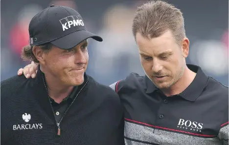  ?? GLYN KIRK / GETTY IMAGES ?? The 145th British Open featured the epic duel between American Phil Mickelson, left, and Sweden’s Henrik Stenson in Sunday’s final round at Royal Troon Golf Club in Troon, Scotland. Stenson shot a final round 63 to win by three strokes over Mickelson,...