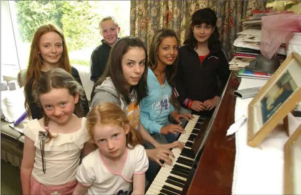  ??  ?? May 2005 - Emily Hughes, Sinead McErlane, Jane Wynne, Donal McErlane, Mary Beth Wynne, Sarah and Alex Wakrim who took part in a sponsored 12 hour non stop music marathon in aid of the Birches Day Care Centre.