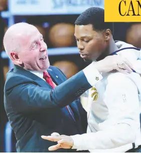  ?? FRANK GUNN / THE CANADIAN PRESS FILES ?? Toronto Raptors guard Kyle Lowry receives his 2019 NBA championsh­ip ring from Larry Tanenbaum, chairman of Maple Leaf Sports & Entertainm­ent, last October.
