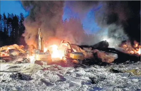  ?? Transporta­tion Safety Board of Canada ?? FLAMES ERUPT from the site of a crude-oil train derailment Feb. 16, one of two such accidents recently in Ontario, Canada.