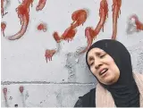  ?? ?? The mother of Muhammad Ayman Ghazawi and Basel Ayman Ghazawi, who were killed by the heavily disguised Israeli agents. Pictures: AFP