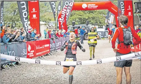  ?? Photos: No Limits Photograph­y. ?? Hilary Gerardi crosses the line in Kinlochlev­en after a sprint finish in the Glen Coe Skyline race.