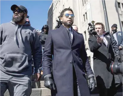  ?? SUN-TIMES FILE PHOTOS ?? Jussie Smollett leaves court in March 2019 after charges that he faked a hate crime against himself were dropped.