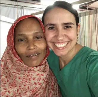  ?? Photo contribute­d ?? Kelowna nurse Crystal Grymaloski, right, takes a selfie with the daughter of a patient in Bangladesh.