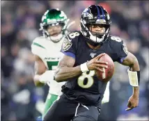  ?? Associated Press photo ?? In this Dec. 12 file photo, Baltimore Ravens quarterbac­k Lamar Jackson (8) runs with the ball as New York Jets outside linebacker Brandon Copeland (51) chases him during the first half of an NFL football game, in Baltimore. The Ravens bring a 12-game winning streak into their playoff matchup with the Tennessee Titans in Saturday night.