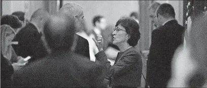  ?? [ANDREW HARNIK/THE ASSOCIATED PRESS] ?? Sen. Susan Collins, R- Maine, speaks with Sen. Rob Portman, R- Ohio, as Republican senators gather Friday to meet with Senate Majority Leader Mitch McConnell, R-Ky., on the GOP effort to overhaul the tax code.