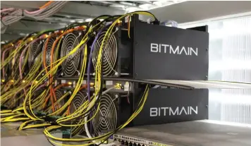  ??  ?? Bitcoin mining computers at Keflavik, Iceland. Bitmain’s main product is called the Antminer. They are filled with dozens or hundreds of high-powered chips, known as Asics, that perform the brute-force number crunching needed to verify virtual currency transactio­ns. |