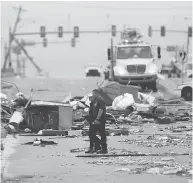  ?? TOM GILBERT / TULSA WORLD VIA THE ASSOCIATED PRESS ?? Links between climate change and natural disasters such as a recent tornado in Tulsa, Okla., are far from concrete.