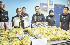  ??  ?? ACP Nasri and officers from the narcotics division showing the seized drugs worth about RM2.5 million.