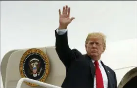  ?? CAROLYN KASTER — ASSOCIATED PRESS ?? President Donald Trump waves as he boards Air Force One at Morristown Municipal Airport, in Morristown, N.J., Sunday en route to Washington after staying at Trump National Golf Club in Bedminster, N.J.