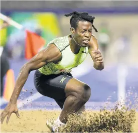  ?? FILE ?? Tajay Gayle goes down injured during his participat­ion in the men’s long jump final at the JAAA National Senior Championsh­ips at the National Stadium in Kingston on Saturday, June 25.