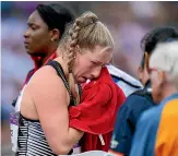  ?? AP ?? Lauren Bruce wipes away tears after failing to register a successful throw in the women’s hammer.