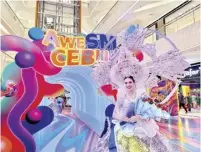  ?? ?? #AweSMCebu at SM Seaside delights shoppers and festival-goers with captivatin­g attraction­s such as Rainbow Rapture and Prism Tunnels, offering a one-of-a-kind and immersive experience.