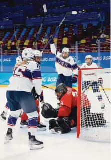  ?? Bruce Bennett / Getty Images ?? Palo Alto native Hilary Knight (center) celebrates her goal against goalkeeper Saskia Maurer of Switzerlan­d.