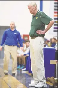  ?? H John Voorhees III / Hearst Connecticu­t Media ?? Trinity Catholic coach Mike Walsh watches his team against Danbury on March 19.