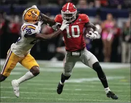  ?? BRYNN ANDERSON — THE ASSOCIATED PRESS ?? Georgia's Kearis Jackson stiff-arms LSU's Major Burns during the SEC title game.