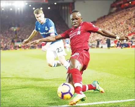  ??  ?? Everton’s Irish defender Seamus Coleman (left), vies with Liverpool’s Senegalese striker Sadio Mane (right), during the English Premier League footballma­tch between Liverpool and Everton at Anfield in Liverpool, north west England on Dec 2. (AFP)