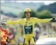  ?? CHRISTOPHE ENA — THE ASSOCIATED PRESS ?? Britain’s Geraint Thomas, wearing the overall leader’s yellow jersey reacts as he crosses the finish line during the twentieth stage of the Tour de France cycling race, an individual time trial over 31 kilometers (19.3 miles) with start in...
