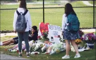  ?? Erik Trautmann / Hearst Connecticu­t Media ?? A memorial outside Wilton High School for George DiRocco, 16, who died unexpected­ly on Monday.