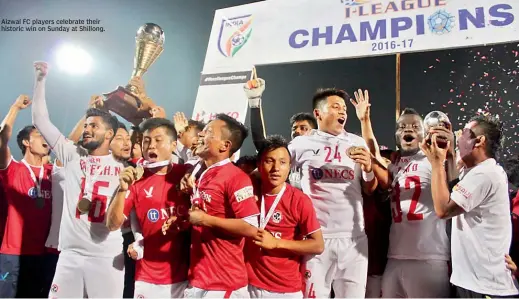  ??  ?? Aizwal FC players celebrate their historic win on Sunday at Shillong.