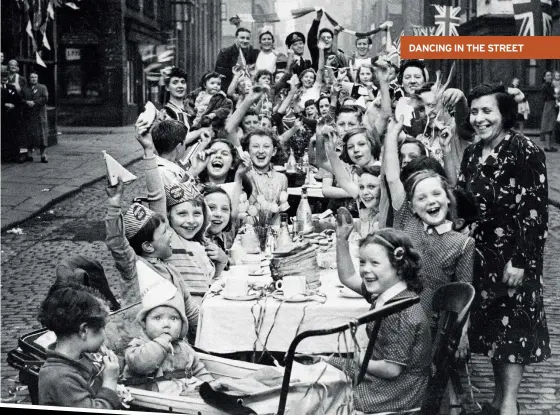  ??  ?? ABOVE Big smiles all round at a VE Day street party in Manchester