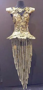  ??  ?? Syjuco’s major draw: A sculptural dress form composed of hand-torched and hammered brass with semi-precious stones