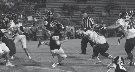  ??  ?? 1-0 0-1 LaFayette quarterbac­k Logan Teasley dives past a Southeast defender for a first down during this past Friday's game. The Raiders scored a fourth-quarter touchdown to pull out a 24-21 win. (Photo by Keith Deal)