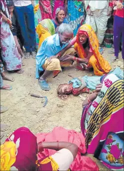  ?? HT FILE PHOTO ?? ▪ A family mourning over a child killed in one of the attacks.