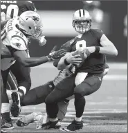  ?? File Photo/AP ?? Saints quarterbac­k Drew Brees (9) is sacked by Patriots defensive end and former Arkansas Razorback Deatrich Wise on Sept. 17 in New Orleans.