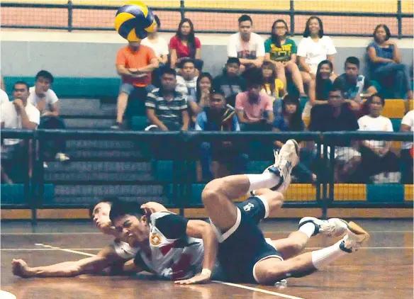  ?? (SUN.STAR FOTO/ARNI ACLAO) ?? NOT OVER YET. The Southweste­rn University Cobras earned a new lease on life after winning Game 2 of the Cesafi men’s volleyball tournament over USJ-R in five sets.