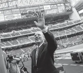  ?? Staff file photo ?? Texans owner Bob McNair waves to fans prior to the first football game at the Reliant Stadium grand opening on Aug. 24, 2002.