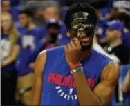  ?? THE ASSOCIATED PRESS FILE ?? Masked man Joel Embiid of the Sixers took to social media to protest his case that he wants to play. Like, now. Broken face and all.