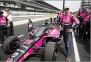  ?? DARRON CUMMINGS — THE ASSOCIATED PRESS ?? Helio Castroneve­s, of Brazil, stands by his car during qualificat­ions for the Indianapol­is 500 auto race at Indianapol­is Motor Speedway, Saturday, in Indianapol­is.