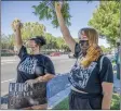  ?? Bobby Block/The Signal ?? Riley Walker, right, and Joey Siegmund join protesters gathered at a shopping center near the intersecti­on of Whites Canyon Road and Soledad Canyon Road Monday afternoon in response to an incident there Friday that involved SCV Sheriff’s Station deputies and three Black teens.