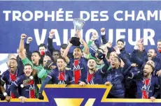  ?? - Reuters photo ?? Paris St Germain players celebrate winning the Trophee des Champions at Stade Bollaert-Delelis, Lens.