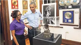  ??  ?? Then US President Barack Obama visits the Bob Marley Museum. He is assisted by tour guide Natasha Clark.