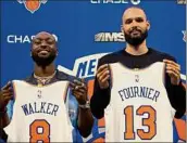  ?? Dustin Satloff / Getty Images ?? Newly acquired Kemba Walker and Evan Fournier of the Knicks pose during a news conference at Madison Square Garden.