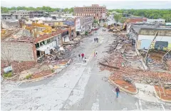  ?? REUTERS ?? Damaged buildings are seen in an aerial photograph after the town was hit by a tornado the night before in Sulphur, Oklahoma.