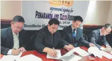  ??  ?? SIGNING the joint-venture agreement under Hinata Housing Corp. are (L-R) Architect Edilberto Morcilla, director of Nedsteel; Antonio Lorenzano, chairman of Nedsteel; Hisao Nakashima, executive vice-president of Kyushu Yaesu Co. Ltd.; and Akira...