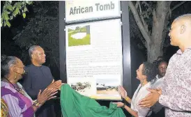  ?? CONTRIBUTE­D PHOTOS ?? Minister of Culture, Gender, Entertainm­ent and Sport, Olivia Grange (left), applauds as Nigerian Foreign Affairs Minister, Geoffrey Onyeama (second left) and Minister of Foreign Affairs and Foreign Trade, Senator Kamina Johnson-Smith (second right), unveil a story board in honour of the African ancestors whose remains were excavated on the grounds of the Seville Heritage Park in St Ann. Sharing the moment is Manchester North West Member of Parliament, Mikael Phillips. A board was also unveiled for his mother, late pan-Africanist Minion Phillips.