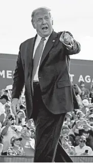  ?? EVAN VUCCI/AP ?? President Donald Trump arrives at a rally in Ocala, Florida, on Friday. Afterward, he traveled to neighborin­g Georgia.