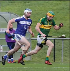  ??  ?? Cloughduv’s Aidan Murphy gets away from Ballinamee­la’s Kevin Phelan